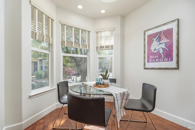 dining room featuring recessed lighting, wood finished floors, and baseboards