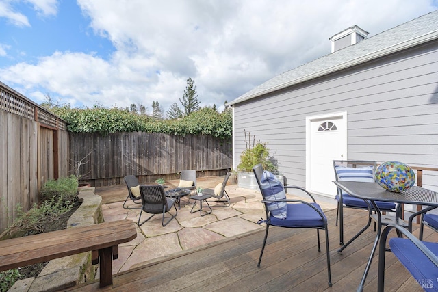 view of patio with a fenced backyard and outdoor dining space