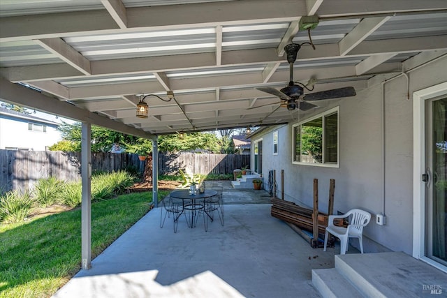 view of patio featuring fence and a ceiling fan