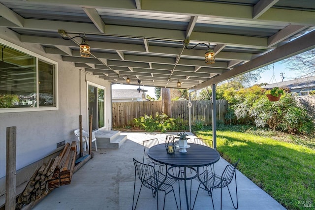 view of patio with entry steps and fence