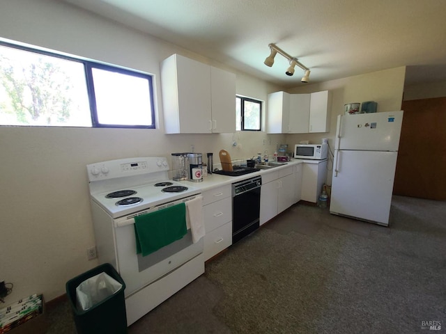 kitchen with light countertops, white appliances, a sink, and white cabinets