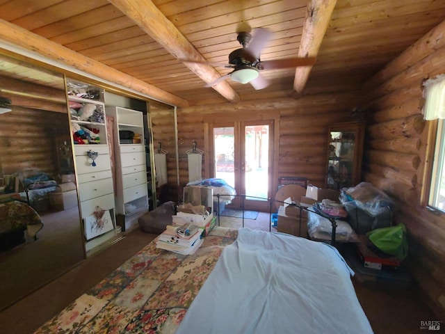 bedroom featuring rustic walls, wooden ceiling, and beam ceiling