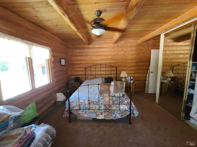 bedroom with wooden ceiling, a closet, and beam ceiling