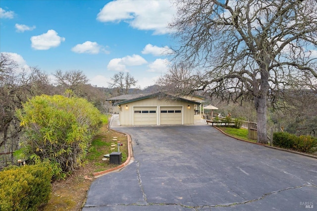 1011 Steele Canyon Rd, Napa, CA 94558 - view of front facade with central AC, driveway, and a detached garage
