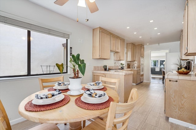 dining area with recessed lighting, ceiling fan, and baseboards