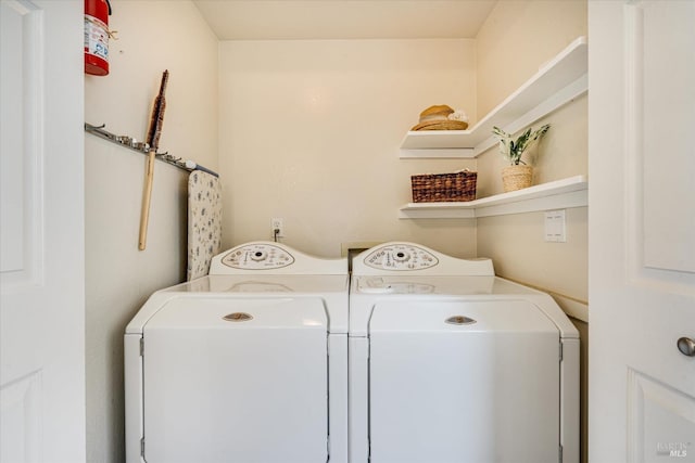 laundry area with laundry area and separate washer and dryer