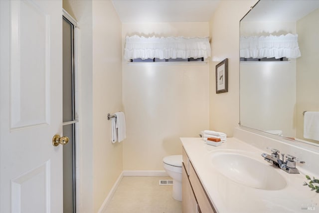 bathroom with visible vents, toilet, an enclosed shower, vanity, and baseboards