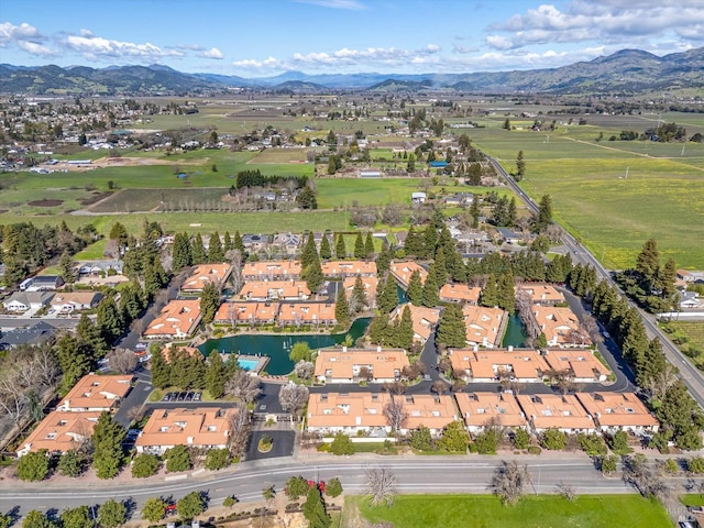 birds eye view of property with a residential view and a mountain view