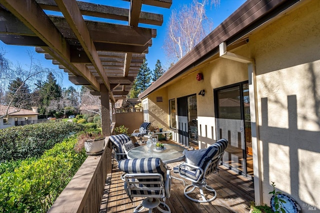 wooden deck featuring outdoor dining area