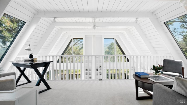 sunroom / solarium with lofted ceiling with beams