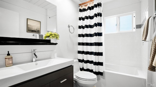 bathroom with shower / tub combo, vanity, and toilet