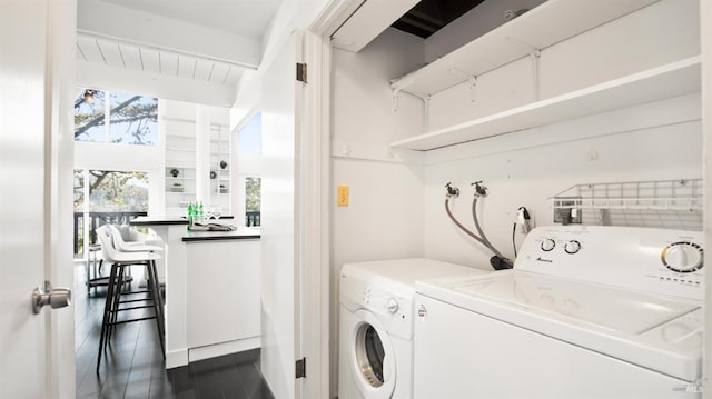 laundry room featuring washing machine and dryer and laundry area