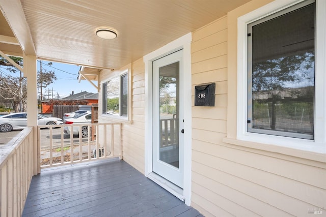 wooden deck featuring covered porch