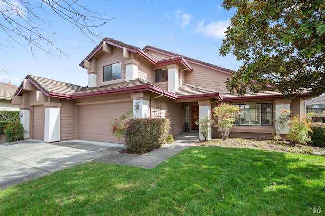 view of front of home featuring an attached garage, a tile roof, a front lawn, and concrete driveway