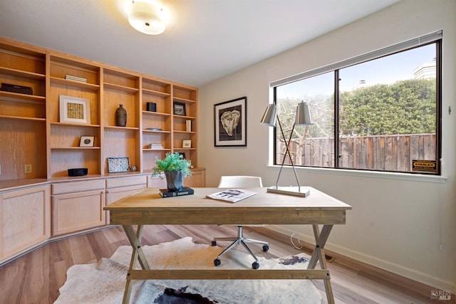 office featuring light wood-style flooring and baseboards