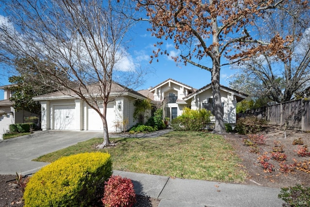 ranch-style house with a garage, concrete driveway, a front yard, and fence