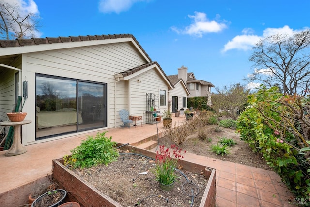 back of property with a patio area