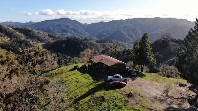 property view of mountains featuring a forest view