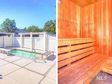 view of swimming pool featuring fence