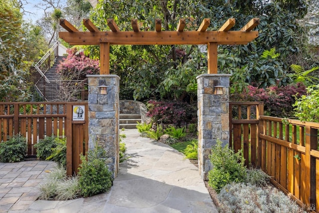 view of gate with fence