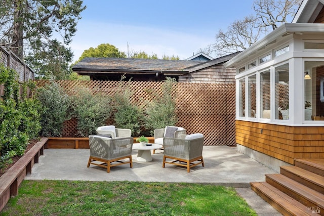 view of patio featuring fence