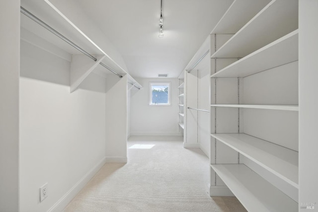 walk in closet featuring carpet and visible vents