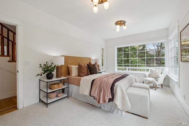 bedroom featuring carpet floors and baseboards