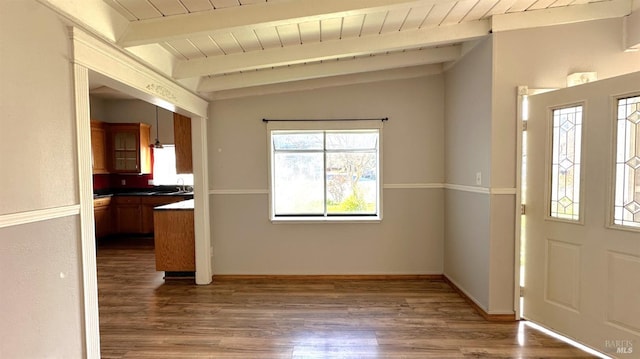 foyer entrance with lofted ceiling with beams, wood ceiling, baseboards, and wood finished floors