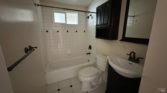 bathroom featuring  shower combination, tile patterned flooring, vanity, and toilet