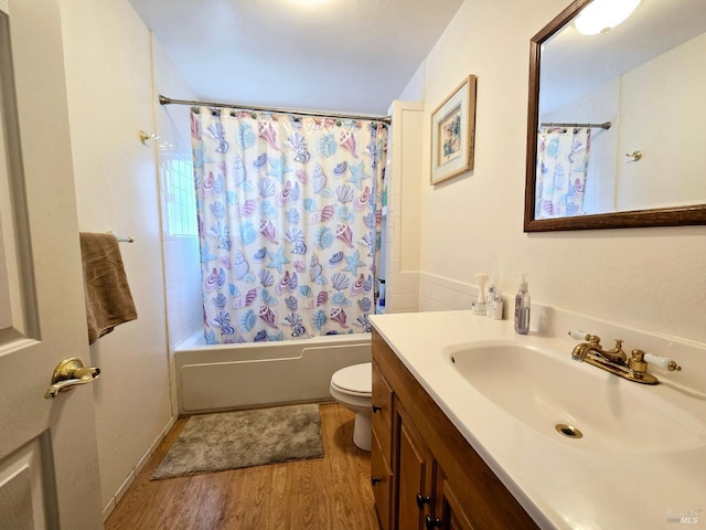 full bathroom featuring vanity, shower / tub combo, wood finished floors, and toilet