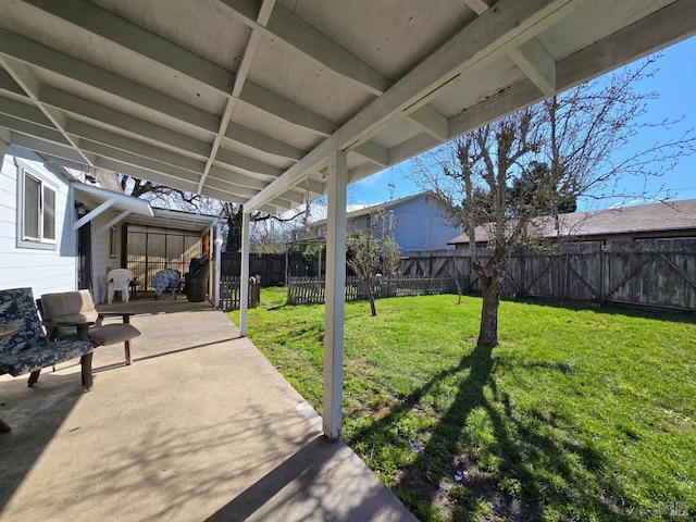 view of yard with a patio area and a fenced backyard