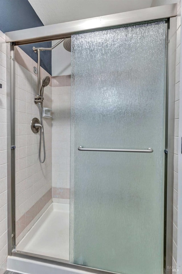 full bathroom with a shower stall