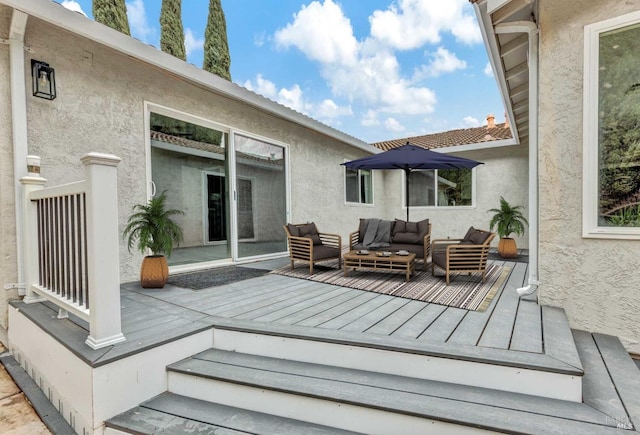 wooden terrace with outdoor lounge area