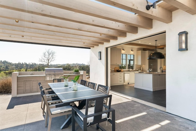 view of patio / terrace featuring outdoor dining space, a grill, and area for grilling