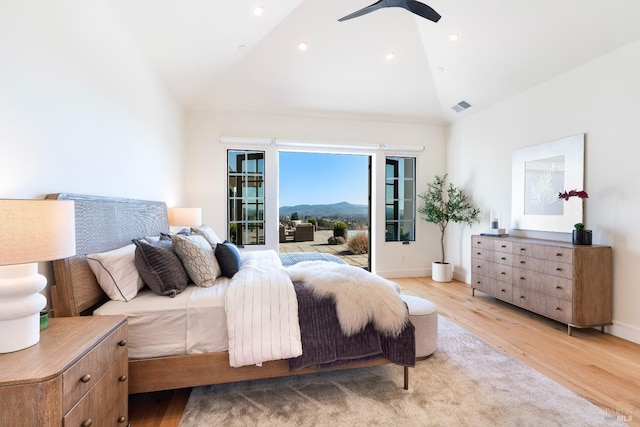 bedroom featuring access to outside, visible vents, light wood-style flooring, and baseboards