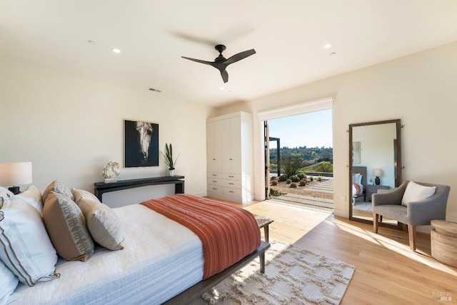 bedroom featuring visible vents, recessed lighting, light wood-style flooring, and access to exterior