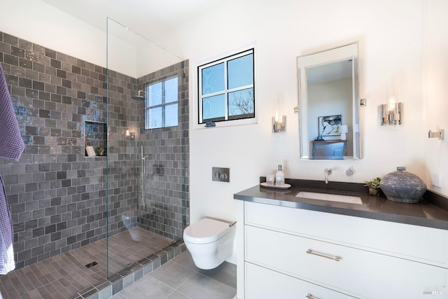 full bath with tile patterned flooring, a shower stall, toilet, and vanity