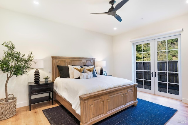 bedroom with access to exterior, recessed lighting, wood finished floors, and french doors