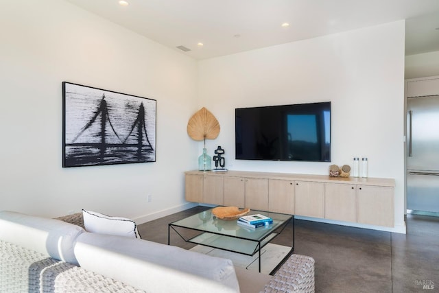 living area with visible vents, finished concrete floors, baseboards, and recessed lighting