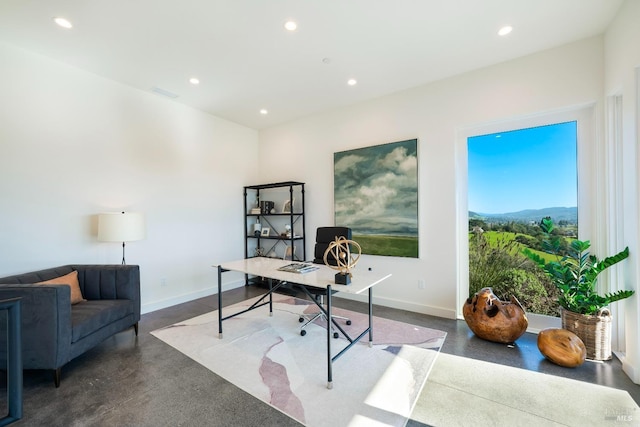 office space featuring baseboards, recessed lighting, visible vents, and finished concrete floors