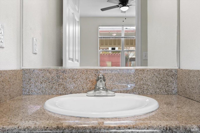 bathroom featuring a ceiling fan and a sink