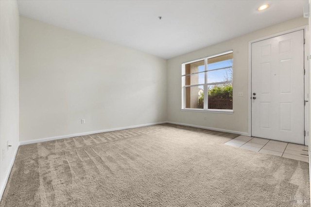 interior space featuring tile patterned flooring, baseboards, and recessed lighting