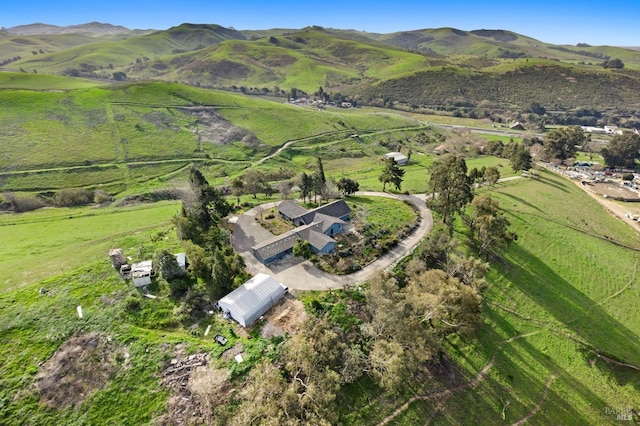 aerial view featuring a rural view and a mountain view