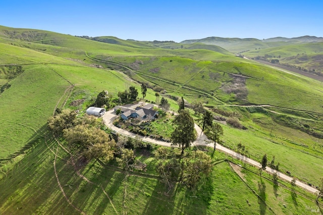 aerial view with a mountain view and a rural view