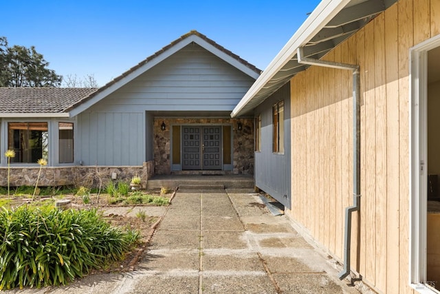 entrance to property with stone siding