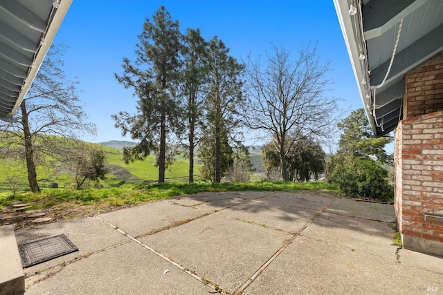 view of patio / terrace featuring a mountain view