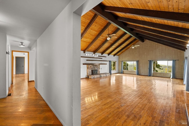 hall featuring wooden ceiling, wood-type flooring, high vaulted ceiling, and beamed ceiling