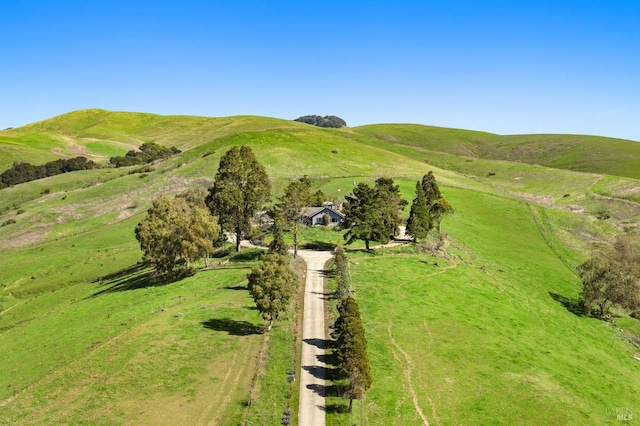 drone / aerial view with a mountain view and a rural view