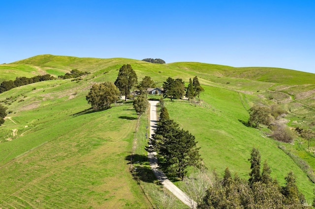 drone / aerial view featuring a mountain view and a rural view