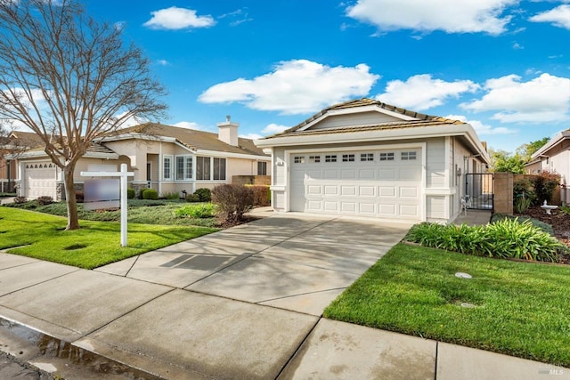 ranch-style house featuring fence, an attached garage, concrete driveway, a front lawn, and a tiled roof